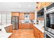 Bright kitchen boasts stainless steel appliances, custom cabinetry, and a large island with white countertops at 1967 Mason Mill Rd, Decatur, GA 30033