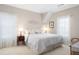 Bright bedroom features a cozy king bed, matching nightstands, and decorative windows at 1967 Mason Mill Rd, Decatur, GA 30033