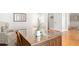 Corner view of a desk with glass top and wingback chair at 1967 Mason Mill Rd, Decatur, GA 30033