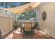 Outdoor patio featuring a sun shade, a dining set, and a cozy spot for al fresco dining at 1967 Mason Mill Rd, Decatur, GA 30033
