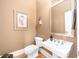 Charming powder room with a pedestal sink and decorative accents at 1967 Mason Mill Rd, Decatur, GA 30033