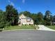 Attractive home with a long driveway, lush lawn, and mature trees offering privacy and curb appeal at 3152 Meadow Glade Ct, Lithonia, GA 30038