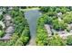 Aerial view of the community pond surrounded by lush greenery and well-maintained properties at 41 Basswood Cir, Sandy Springs, GA 30328