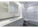 Well-lit, minimalist bathroom with tub, vanity and sleek modern lighting at 41 Basswood Cir, Sandy Springs, GA 30328