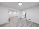 Open-concept dining room with modern flooring, neutral colors, and seamless flow to living spaces at 41 Basswood Cir, Sandy Springs, GA 30328