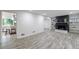 Spacious living room featuring modern flooring, a stylish fireplace, and bright, open space at 41 Basswood Cir, Sandy Springs, GA 30328