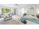 Staged main bedroom with accent wall, sitting area and natural light from the large window at 41 Basswood Cir, Sandy Springs, GA 30328