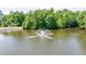 Scenic pond with fountain feature, surrounded by lush green trees at 41 Basswood Cir, Sandy Springs, GA 30328