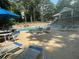 Inviting swimming pool area with lounge chairs, umbrellas, and a multi-level deck for relaxation and enjoyment at 41 Basswood Cir, Sandy Springs, GA 30328