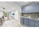 A beautifully decorated wet bar with sleek countertops and cabinets is adjacent to the open living area at 41 Basswood Cir, Sandy Springs, GA 30328