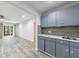 Charming wet bar adjacent to the living room, featuring sleek countertops and cabinets at 41 Basswood Cir, Sandy Springs, GA 30328