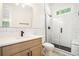 Bathroom with white vanity, subway tiles, and glass shower at 4276 Lindsey Ne Way, Roswell, GA 30075