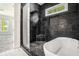 Sleek bathroom features a glass shower, tub, and natural light at 4276 Lindsey Ne Way, Roswell, GA 30075