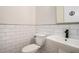 Contemporary powder room with black fixtures and subway tile at 4276 Lindsey Ne Way, Roswell, GA 30075