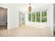Sunlit dining area featuring hardwood floors, large windows, and a modern chandelier at 4276 Lindsey Ne Way, Roswell, GA 30075