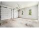 Spacious garage with two doors and natural light at 4276 Lindsey Ne Way, Roswell, GA 30075