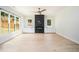 Bright living room with a fireplace, hardwood floors, and large windows overlooking the yard at 4276 Lindsey Ne Way, Roswell, GA 30075