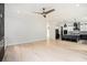 Spacious living room with hardwood floors adjacent to a kitchen with stainless appliances at 4276 Lindsey Ne Way, Roswell, GA 30075