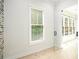 Bright office space with hardwood floors, a large window, and a glass door at 4276 Lindsey Ne Way, Roswell, GA 30075