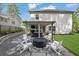 Spacious backyard featuring a patio, fire pit, and ample green space at 779 Sanders Rd, Cumming, GA 30041