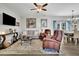 Bright living space with modern furnishings, hardwood floors, and plenty of space to relax at 779 Sanders Rd, Cumming, GA 30041