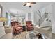 Spacious living area with hardwood floors, cozy seating, and staircase view at 779 Sanders Rd, Cumming, GA 30041