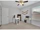 Comfortable home office space with a printer, natural light, and neutral tones at 779 Sanders Rd, Cumming, GA 30041