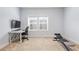 Bright bedroom featuring a dedicated workspace and exercise equipment at 1188 Parktown Dr, Mableton, GA 30126