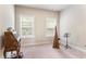 Bright bedroom with two windows, neutral carpet, and antique desk at 1188 Parktown Dr, Mableton, GA 30126
