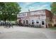 Exterior view of the Comet Trail Cycles building, lined with a variety of bicycles for sale or rent at 1188 Parktown Dr, Mableton, GA 30126