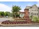 Entrance to Concord Trails with attractive brick signage surrounded by vibrant flower beds at 1188 Parktown Dr, Mableton, GA 30126