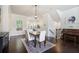 Open-concept dining area with hardwood floors, and seamless flow to kitchen at 1188 Parktown Dr, Mableton, GA 30126