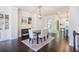 Elegant dining area with hardwood floors, stylish lighting, and convenient access to kitchen at 1188 Parktown Dr, Mableton, GA 30126