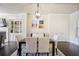Dining room featuring a modern light fixture, seating for six and a view of the fireplace at 1188 Parktown Dr, Mableton, GA 30126