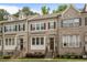 Charming townhome exterior featuring brick facade, shuttered windows, and welcoming front entrance at 1188 Parktown Dr, Mableton, GA 30126