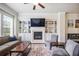 Cozy living room features a fireplace, built-in shelving, and an open layout at 1188 Parktown Dr, Mableton, GA 30126