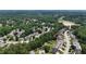 Expansive aerial view of planned community near a lake, with lush green landscaping and tree-lined streets at 1274 Ridge Vista Ct, Lawrenceville, GA 30043