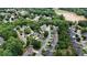 Aerial view showcases home in community near a lake, with lush landscaping and tree-lined streets at 1274 Ridge Vista Ct, Lawrenceville, GA 30043