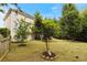 Lush backyard featuring mature trees, well-maintained lawn, and partial fencing for privacy at 1274 Ridge Vista Ct, Lawrenceville, GA 30043