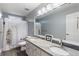 Bathroom featuring double sinks with a granite countertop and shower with tub at 1274 Ridge Vista Ct, Lawrenceville, GA 30043