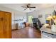 Comfortable bedroom with hardwood floors, a ceiling fan, and a window at 1274 Ridge Vista Ct, Lawrenceville, GA 30043