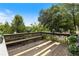 Wooden deck with a built-in bench overlooking the lush backyard at 1274 Ridge Vista Ct, Lawrenceville, GA 30043
