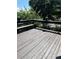 Outdoor deck with bench seating and potted plants, perfect for enjoying the weather at 1274 Ridge Vista Ct, Lawrenceville, GA 30043