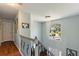 Hallway with a decorative chandelier, hardwood floors, and a staircase at 1274 Ridge Vista Ct, Lawrenceville, GA 30043