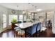 Well-lit kitchen featuring a large island, modern appliances, and an adjacent breakfast area at 1274 Ridge Vista Ct, Lawrenceville, GA 30043