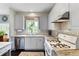 Well-lit kitchen featuring stainless steel appliances, granite countertops, and ample cabinet space at 1274 Ridge Vista Ct, Lawrenceville, GA 30043