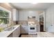 Bright kitchen featuring stainless steel appliances, granite countertops, and custom cabinetry at 1274 Ridge Vista Ct, Lawrenceville, GA 30043