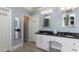 Well-lit bathroom featuring double sinks with granite countertops and ample cabinetry at 1274 Ridge Vista Ct, Lawrenceville, GA 30043