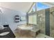 Bright bathroom featuring a corner bathtub, glass shower, and double sinks at 1274 Ridge Vista Ct, Lawrenceville, GA 30043