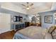 Beautiful main bedroom with a king-size bed, tray ceiling, and sitting area at 1274 Ridge Vista Ct, Lawrenceville, GA 30043